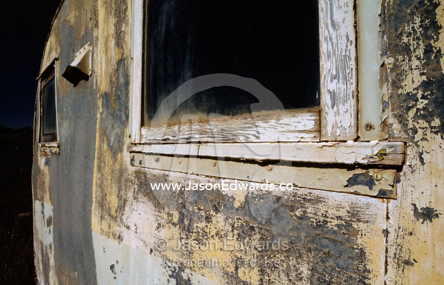 A weathered old trailer with peeling paint in the Australian outback. Konalda Station, Nullarbor Plain, South Australia.