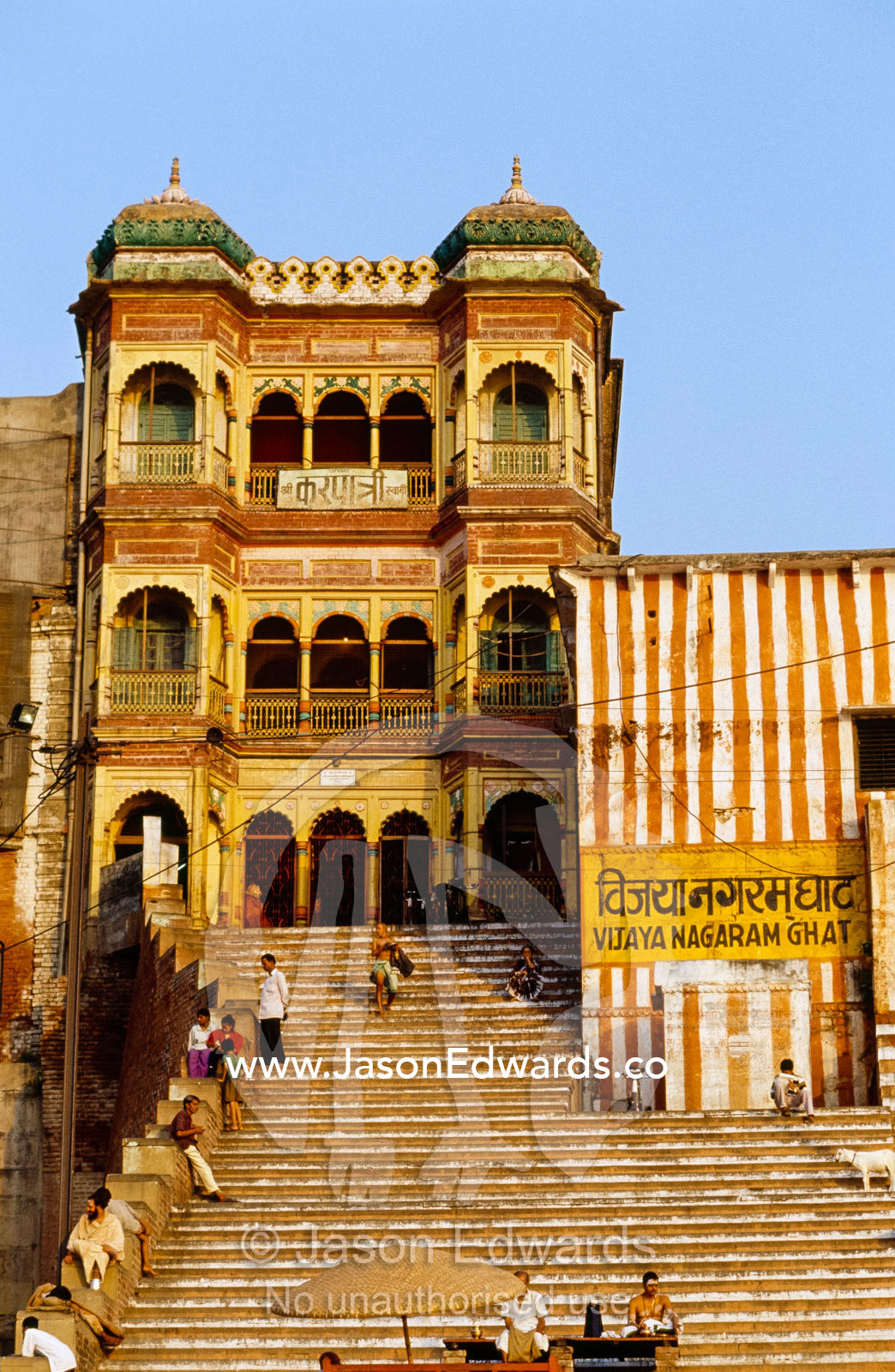 A sandstone ghat or stairway leading down to the Ganges River. Varanasi, India.