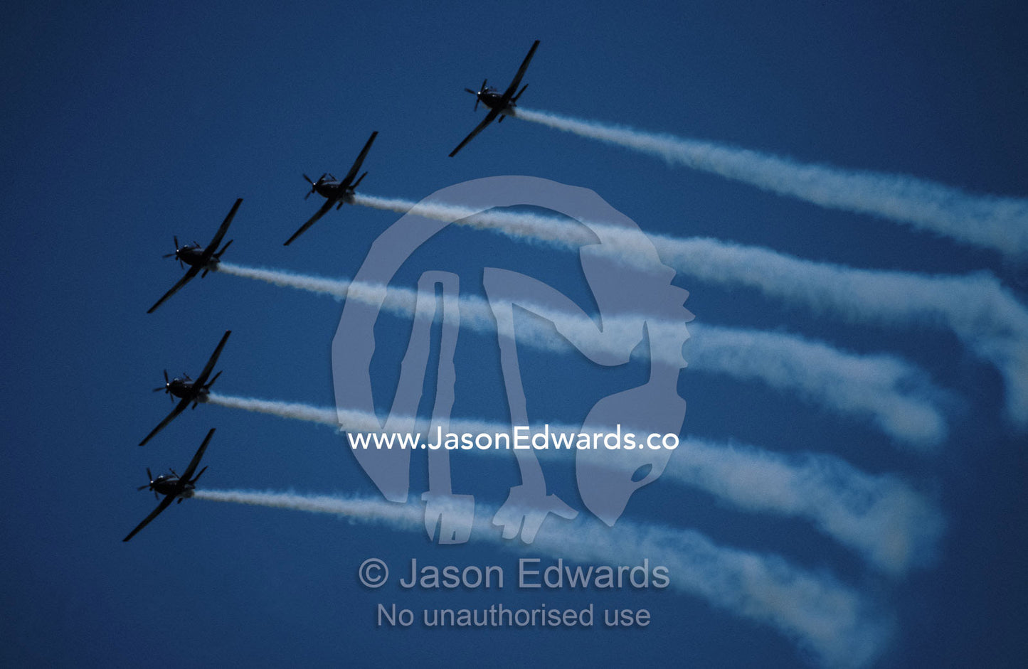 The Pilatus PC-9A Roullettes stunt flying in formation trailing smoke. Avalon International Airshow, Victoria Australia