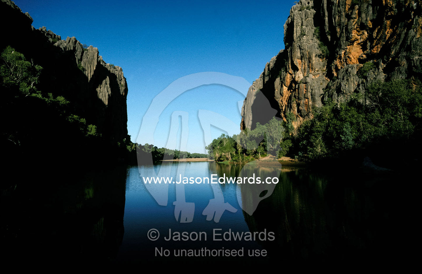 Cool, deep waters fill a billabong in an outback desert gorge. Windjana Gorge Kimberley Ranges Western Australia.
