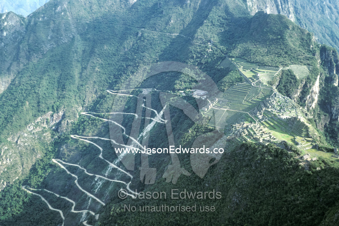 Winding mountainous road leading to the Machu Picchu Inca ruins. Machu Picchu, Peru.