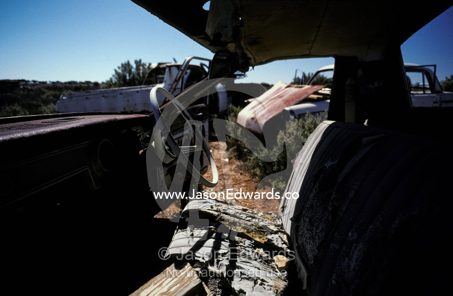 Antique rusting car wrecks in an outback desert junk yard. Konalda Station, Nullarbor Plain, South Australia.