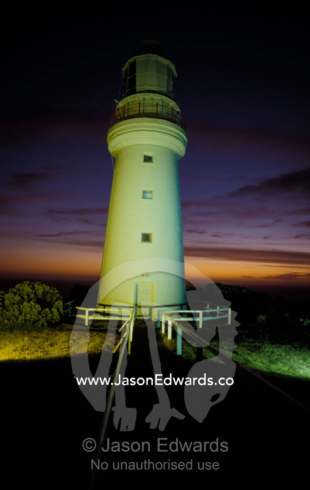 As the sky darkens lighting illuminates the Cape Otway Lighthouse. Cape Otway National Park Victoria Australia.
