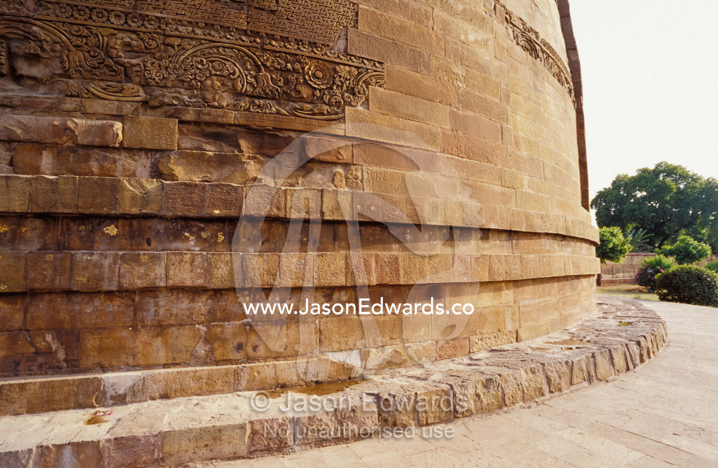 Damekh Stupa brick work and stone engraving on an ancient Indian ruin. Sarnath, India.