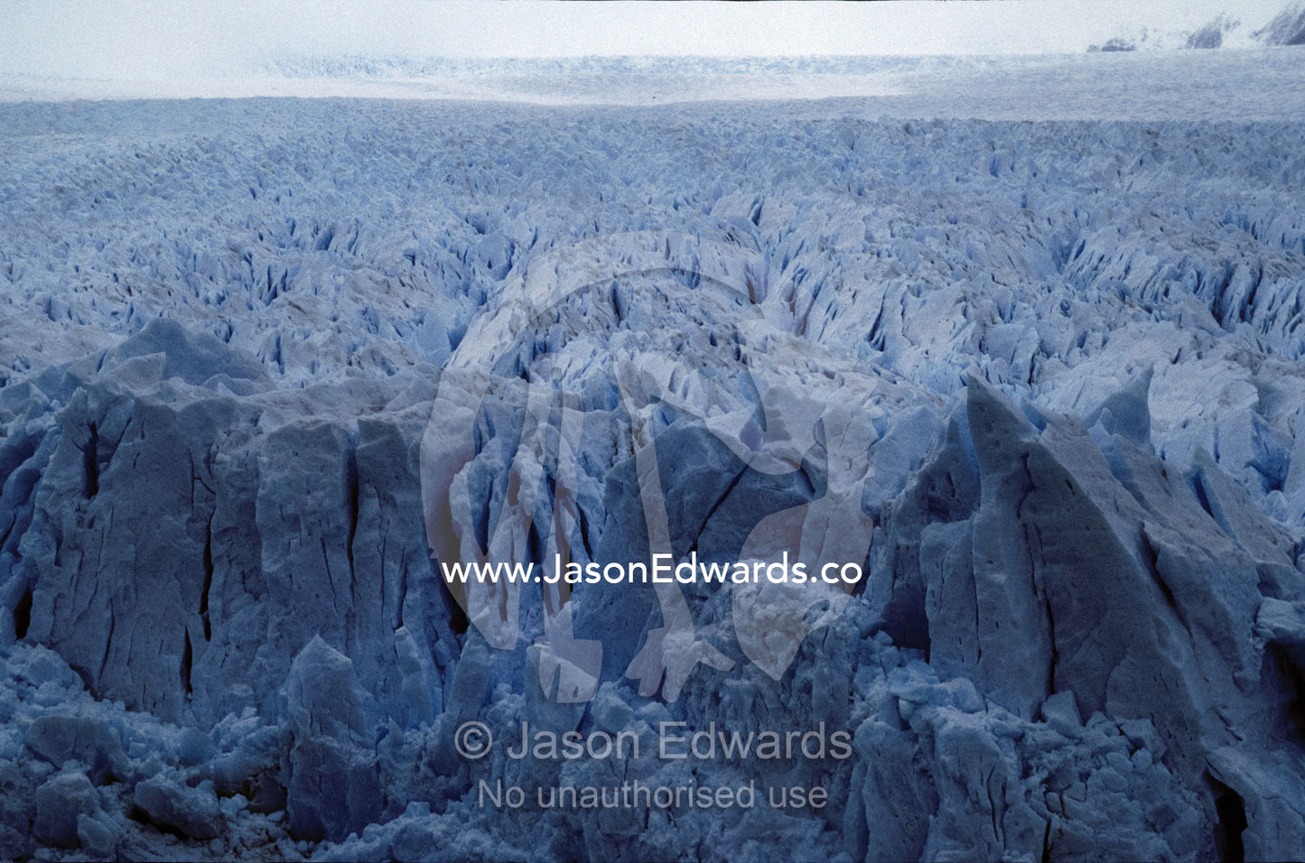 The jagged ice and fracture zone of a vast and menacing Glacier. Parque Nacional Los Glaciers, Patagonia, Argentina.