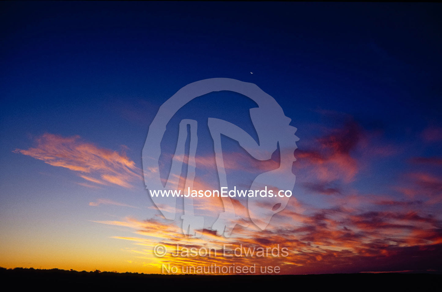 A specactular sunset and cloud formation over a vast desert plain. Simpson Desert Conservation Park, South Australia.