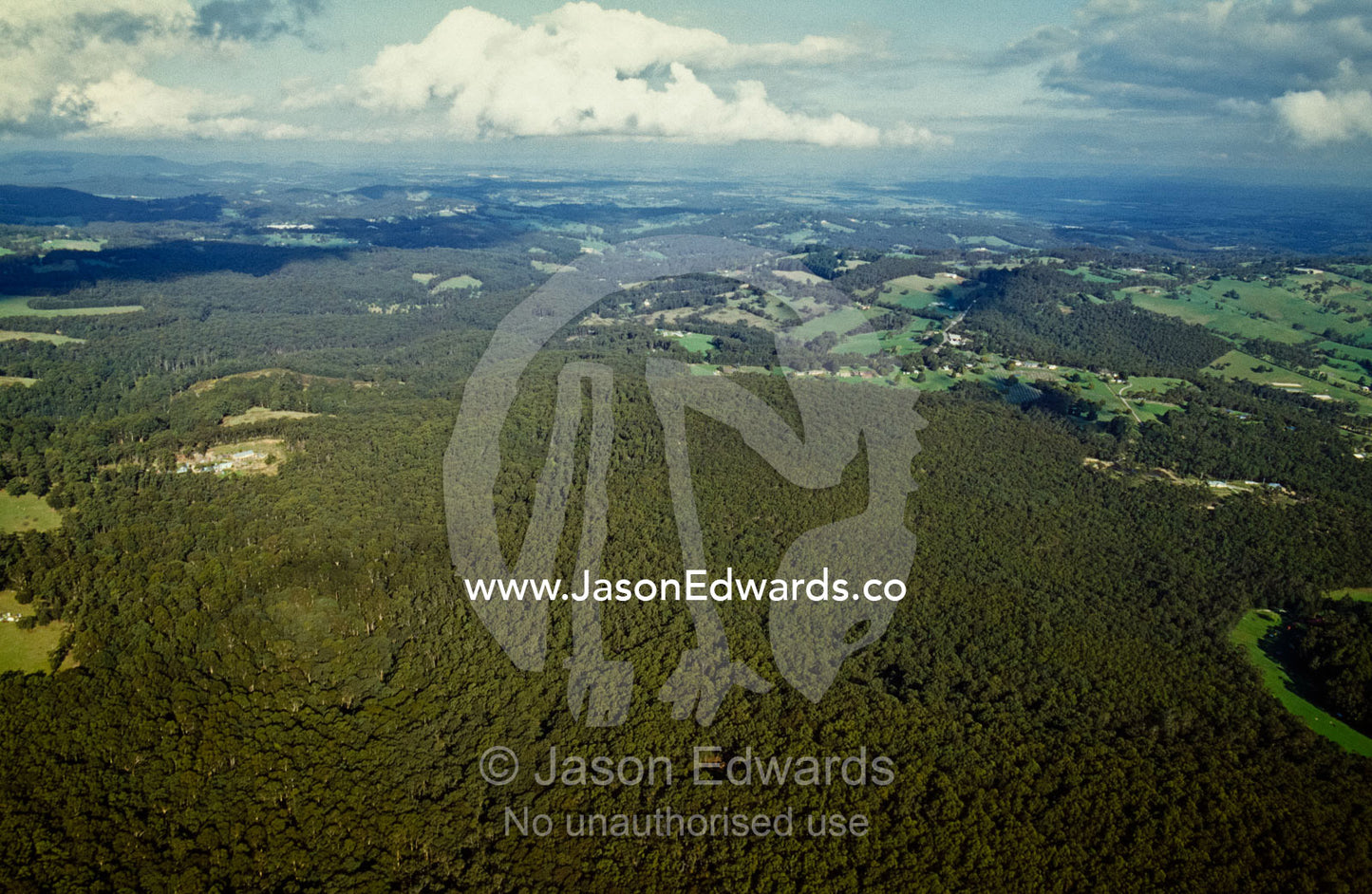 Aerial view of threatened Bunyip forest surrounded by farmland. Bunyip State Forest, Victoria, Australia.