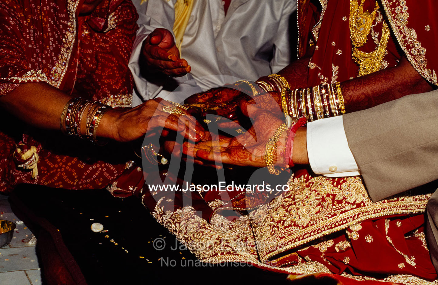 The exchange of hands during a Hindu wedding ceremony. Sawai Madhopur, Rajasthan State, India.