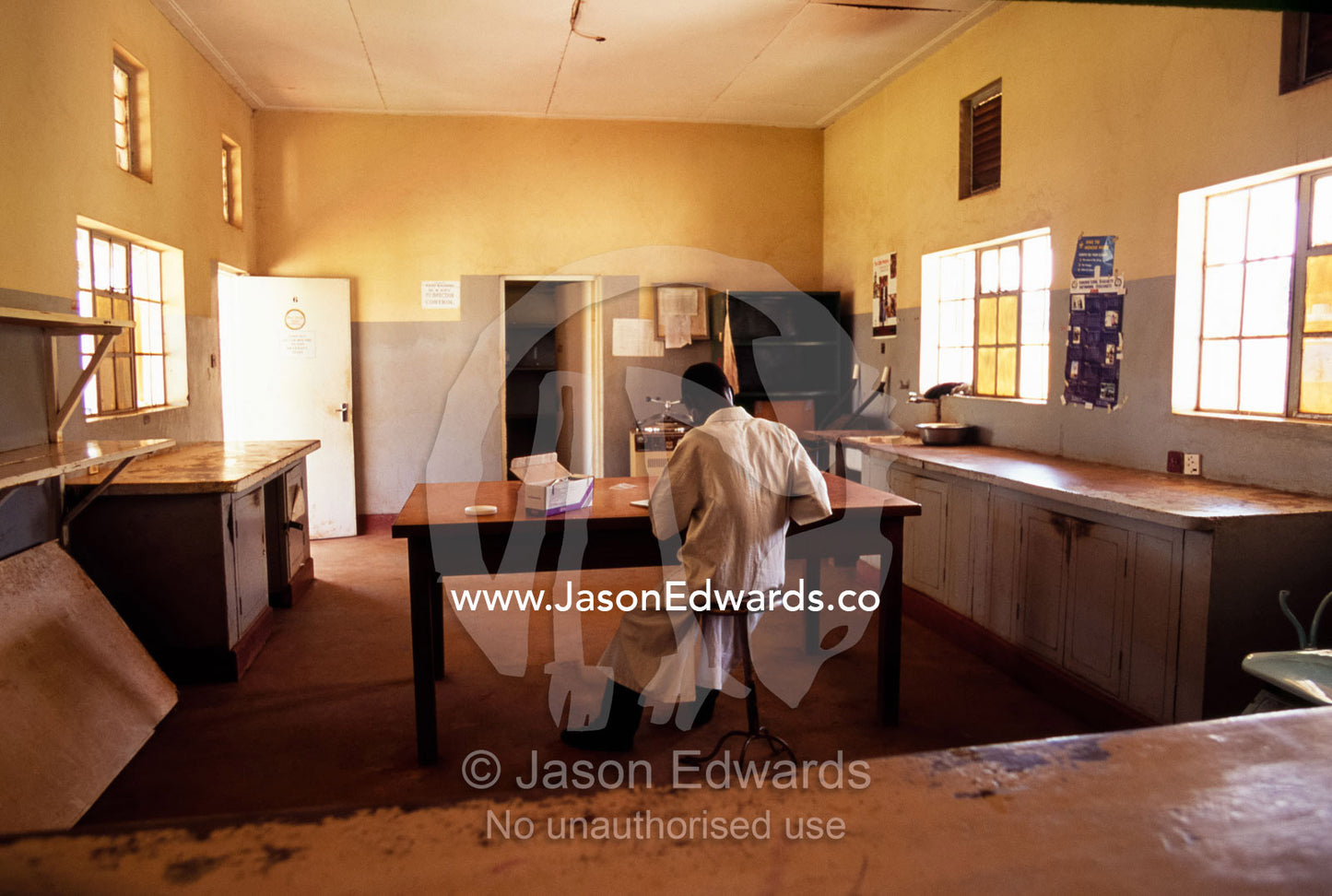 A clinical physician dispensing HIV AIDS medications at a hospital. Tororo District Hospital, Tororo District, Uganda.