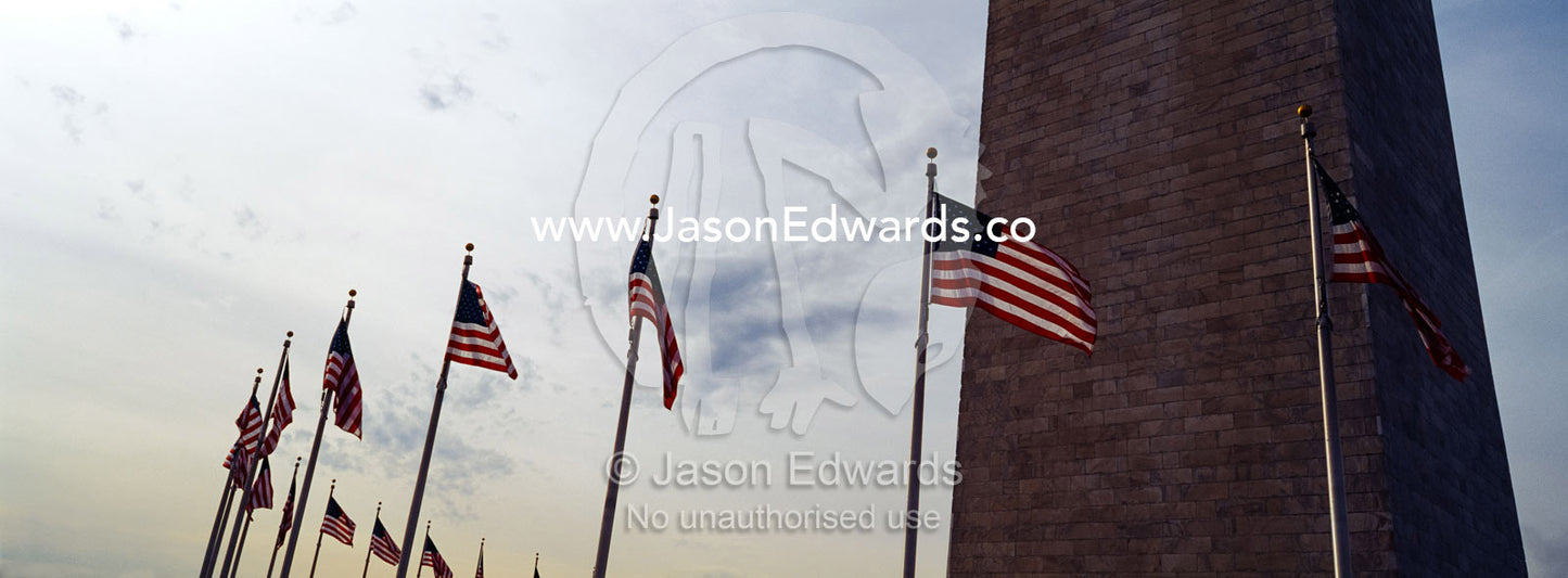 The American flag, Old Glory, flies near the Washington Monument. Washington DC, USA, United States of America.