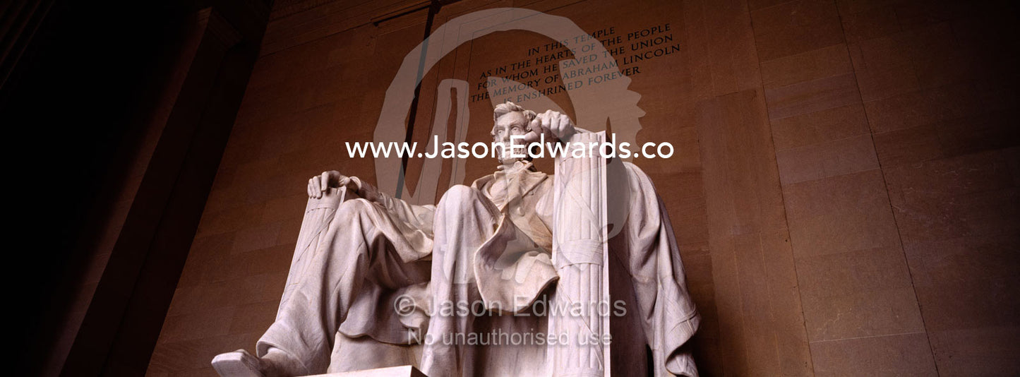 A statue of Abraham Lincoln sits proudly in the Lincoln Memorial. Washington DC, USA, United States of America.
