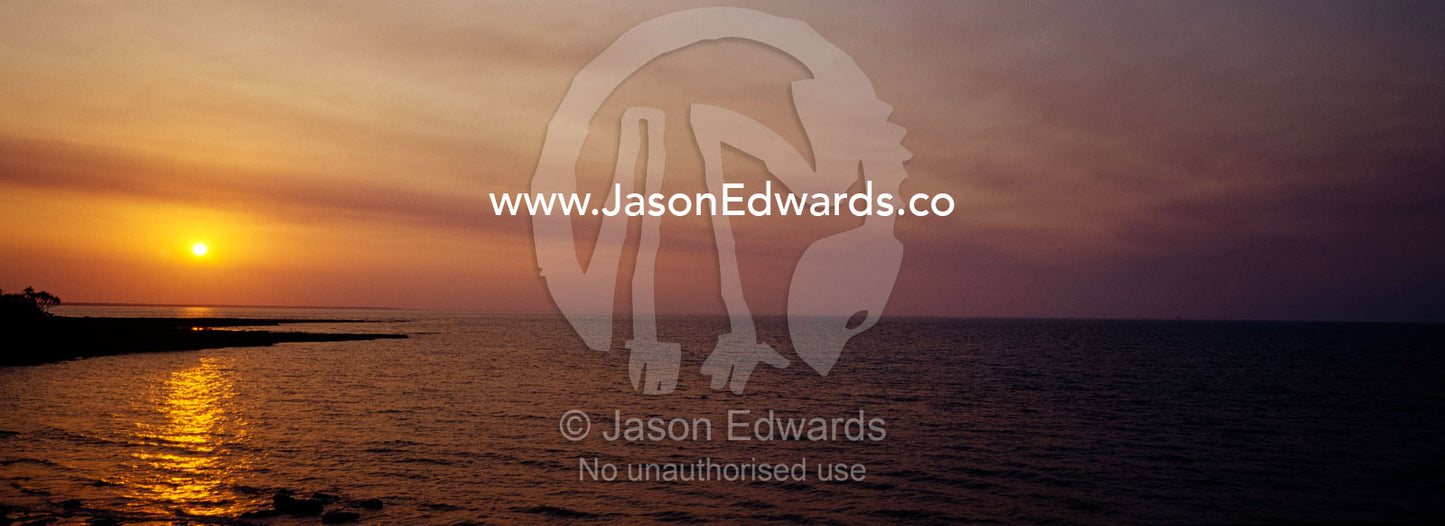 Sunset over the tranquil seas of Beagle Gulf in Northern Australia. East Point, Darwin, Northern Territory, Australia.