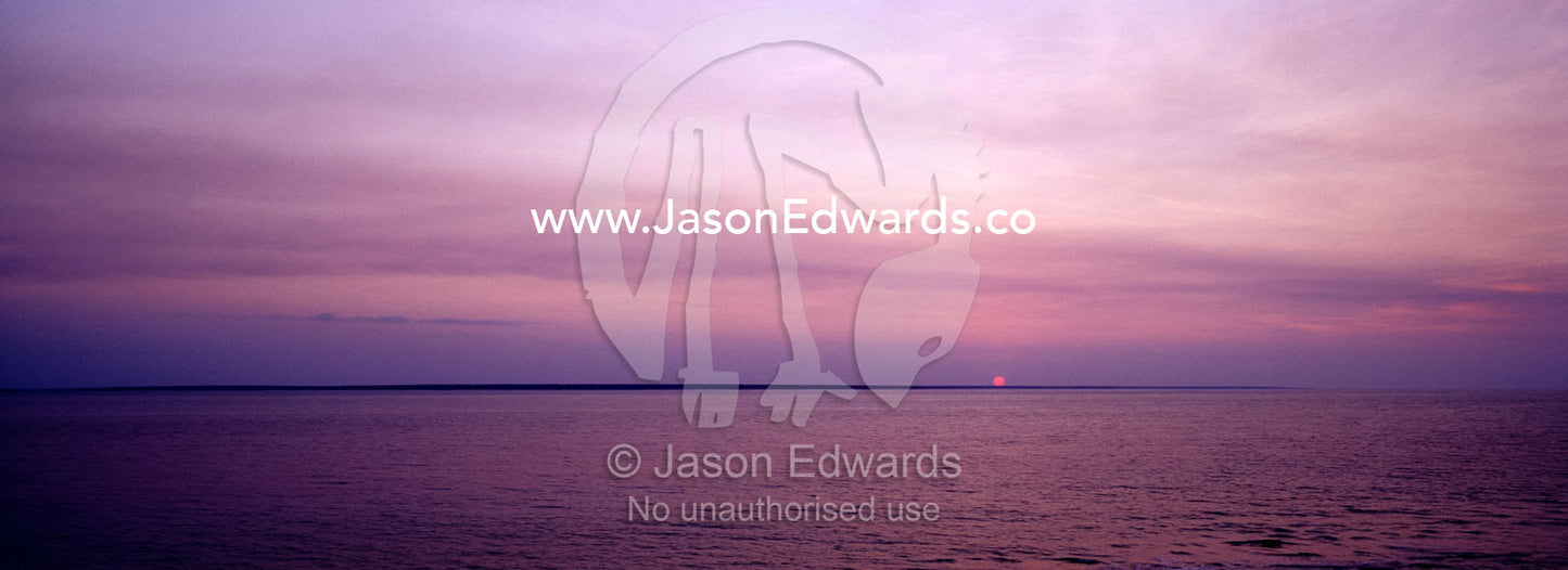 Sunset over the tranquil seas of Beagle Gulf in Northern Australia. Darwin, Northern Territory, Australia.