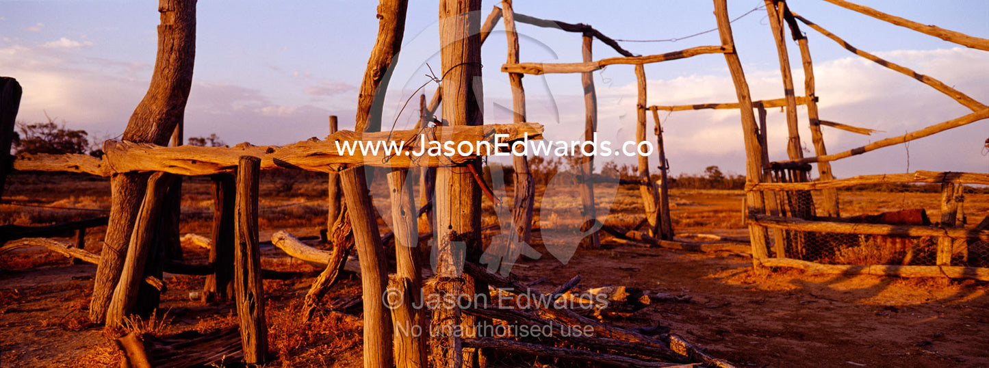Sunset descends over antique cattle station ruins in the desert. Sturt National Park, New South Wales, Australia.