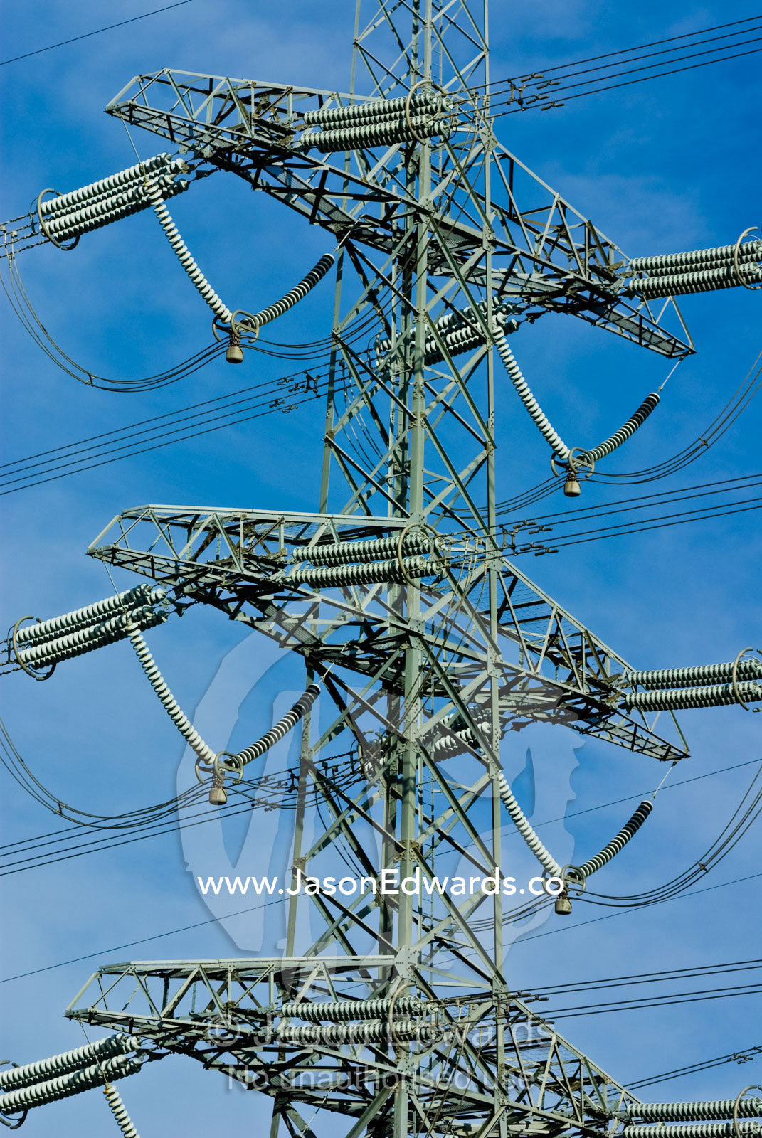 High voltage power lines on a massive steel tower carry electricity. Ringwood, Victoria, Australia.