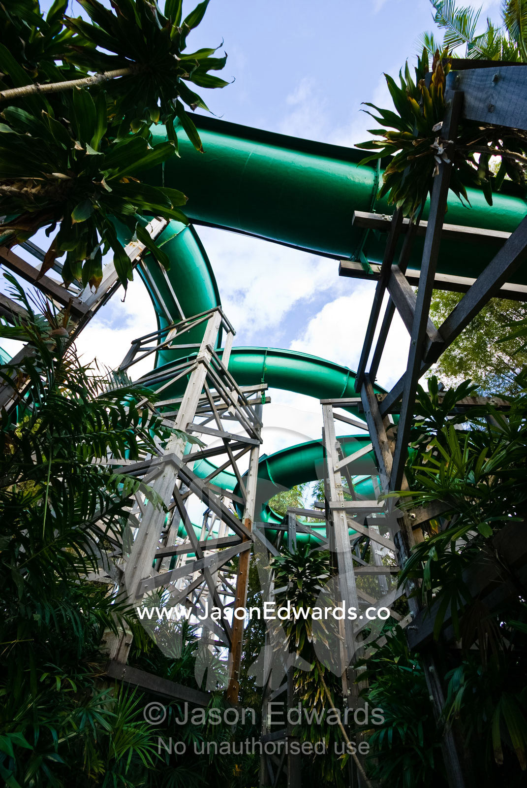 Giant water slides twist and turn through a tourist theme park. Waterbom Park, Tuban, Bali, Indonesia.
