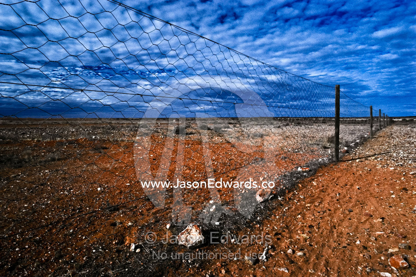 Running 5320 kilometers the Dingo Fence is the world's longest fence. near Coober Pedy, South Australia, Australia.