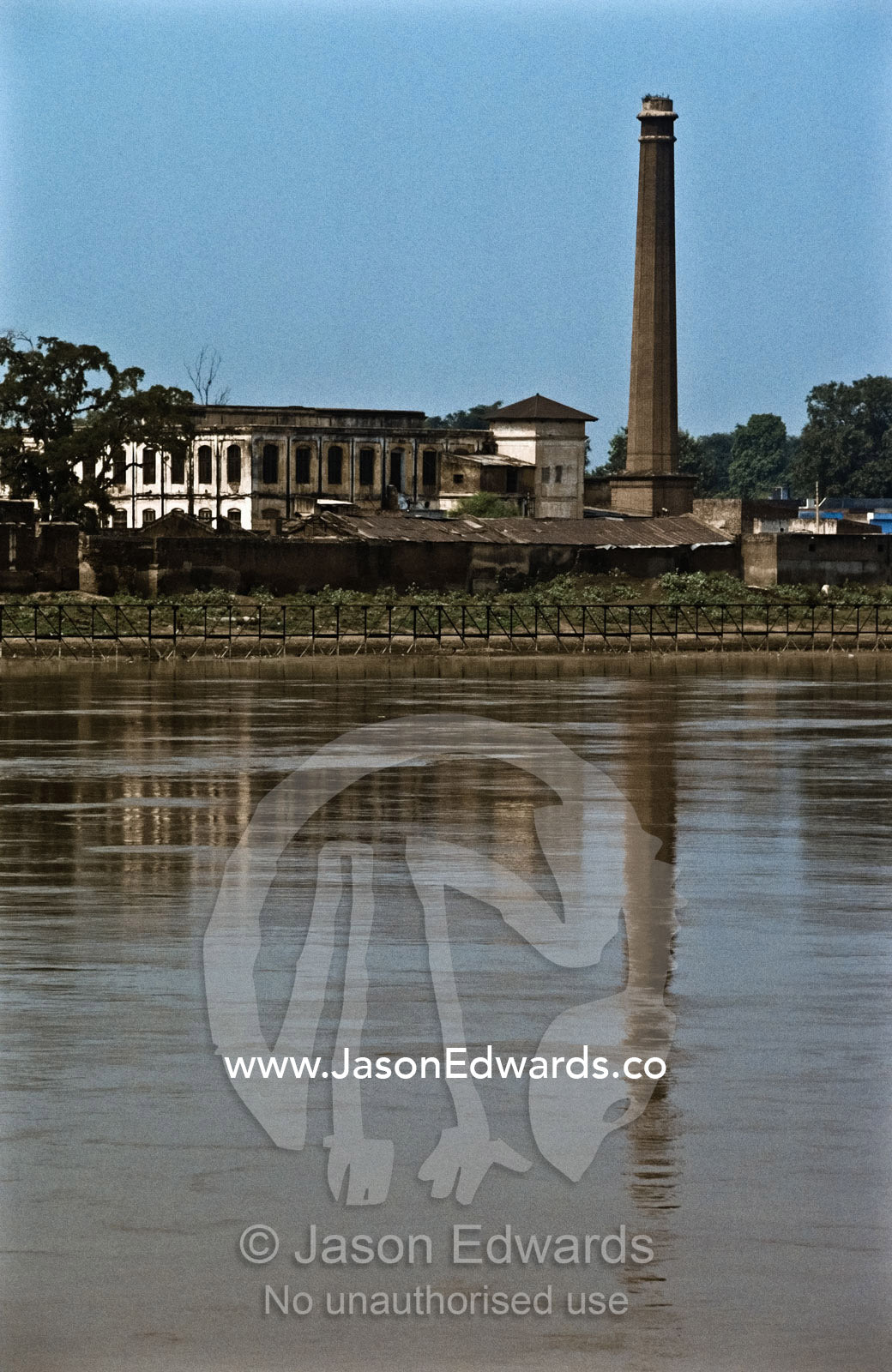 Factory pollution on the Yamuna River a major tributary of the Ganges. Yamuna River, Agra, India.