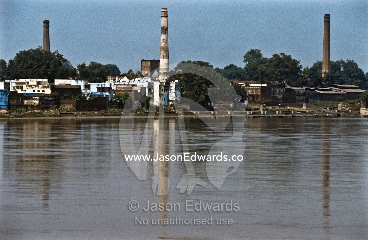 Factory pollution on the Yamuna River a major tributary of the Ganges. Yamuna River, Agra, India.