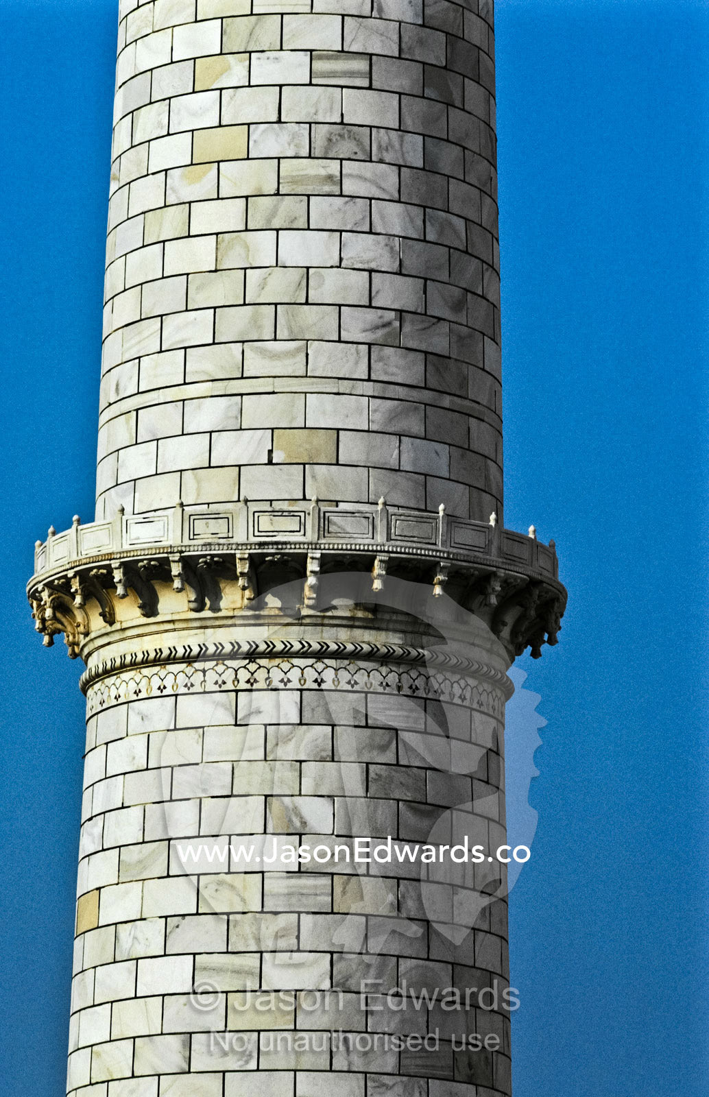 A balcony on a marble minaret by the mausoleum at the Taj Mahal. Agra, Uttar Pradesh, India.