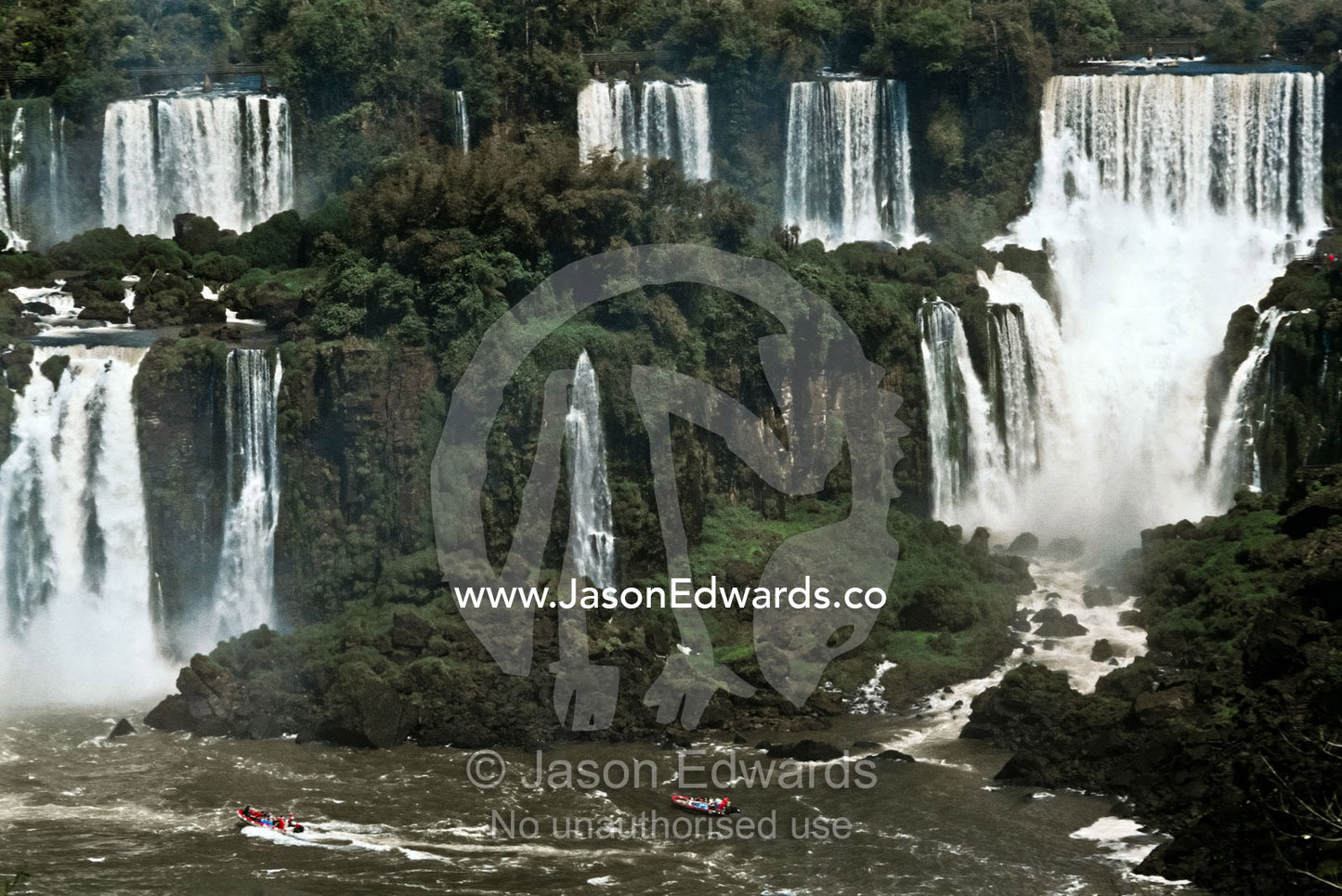 The Iguazo River plummets through steaming subtropical rainforest. Iguazo Falls, Iguazu National Park, Argentina.