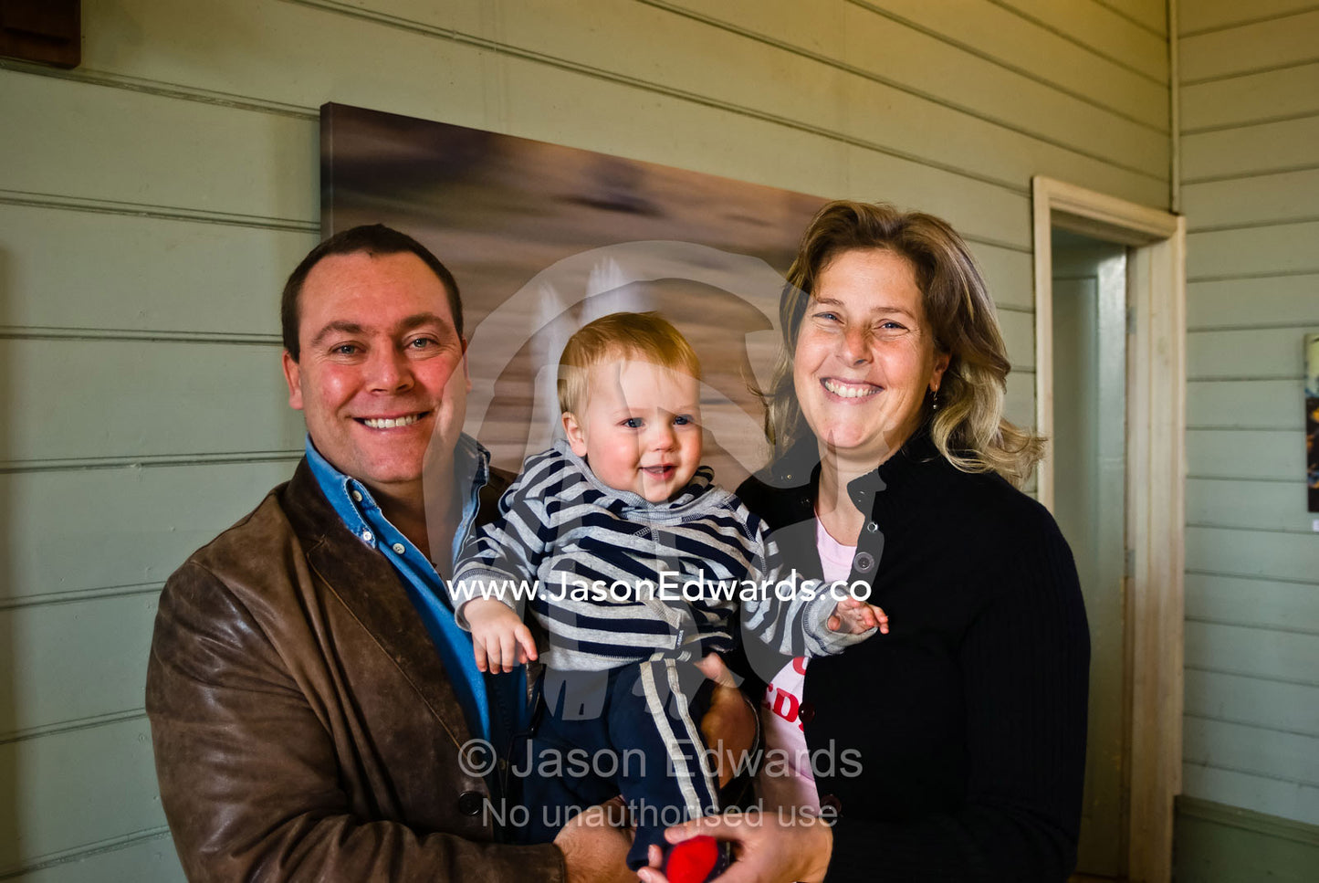 A happy family touring a photographic exhibition on a winter day. Glenlyon, Victoria, Australia.