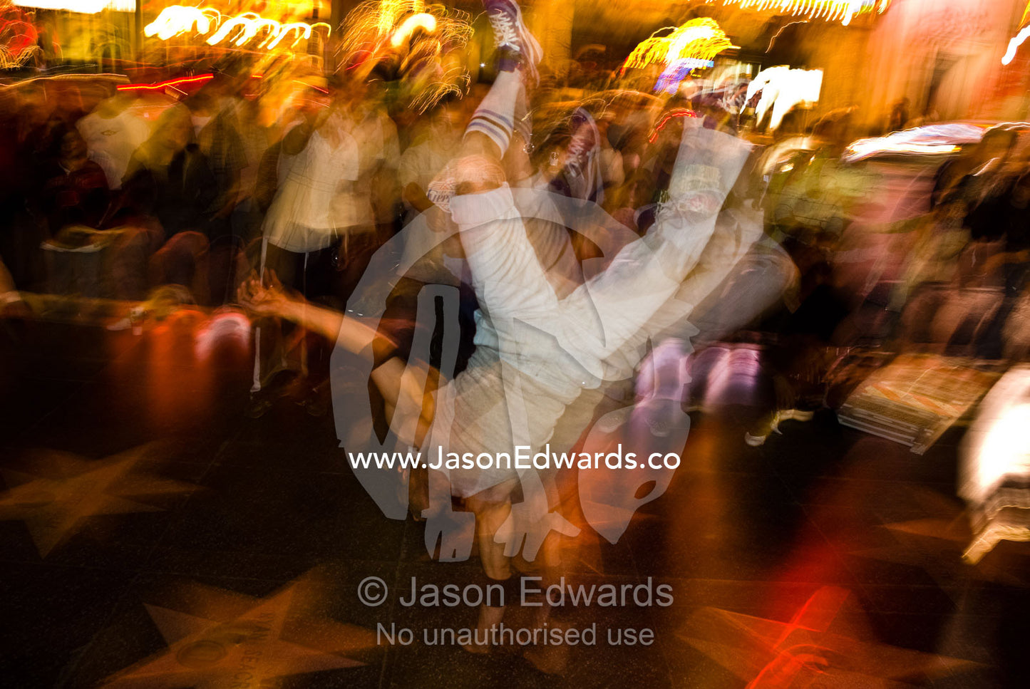 A street performer displays acrobatic skills on Hollywood Boulevard. Hollywood Boulevard, Los Angeles, California.