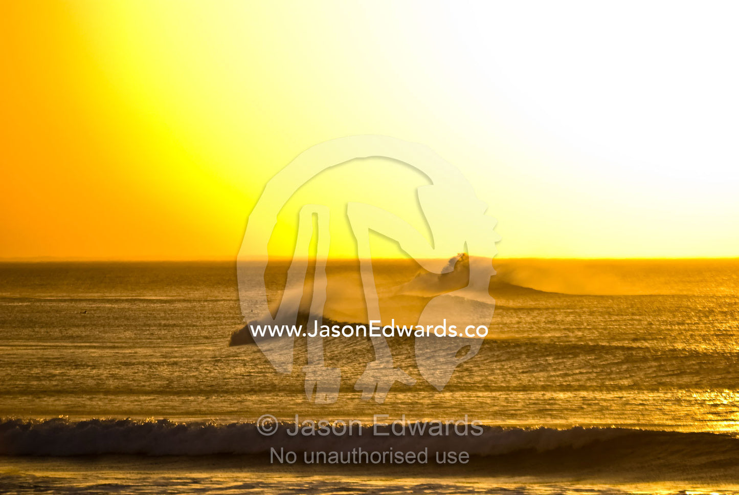 Clean lines of swell from Bass Strait roll over a reef at dawn. Point Danger, Torquay, Surf Coast, Victoria, Australia.