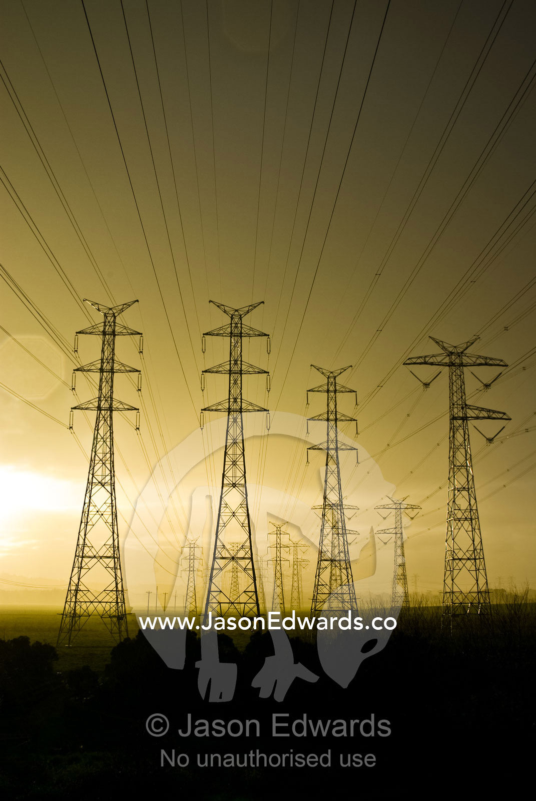 A vast array of electrical towers and cables rise into a rain storm. Eastern and Southeastern Suburbs, Melbourne, Victoria, Australia.