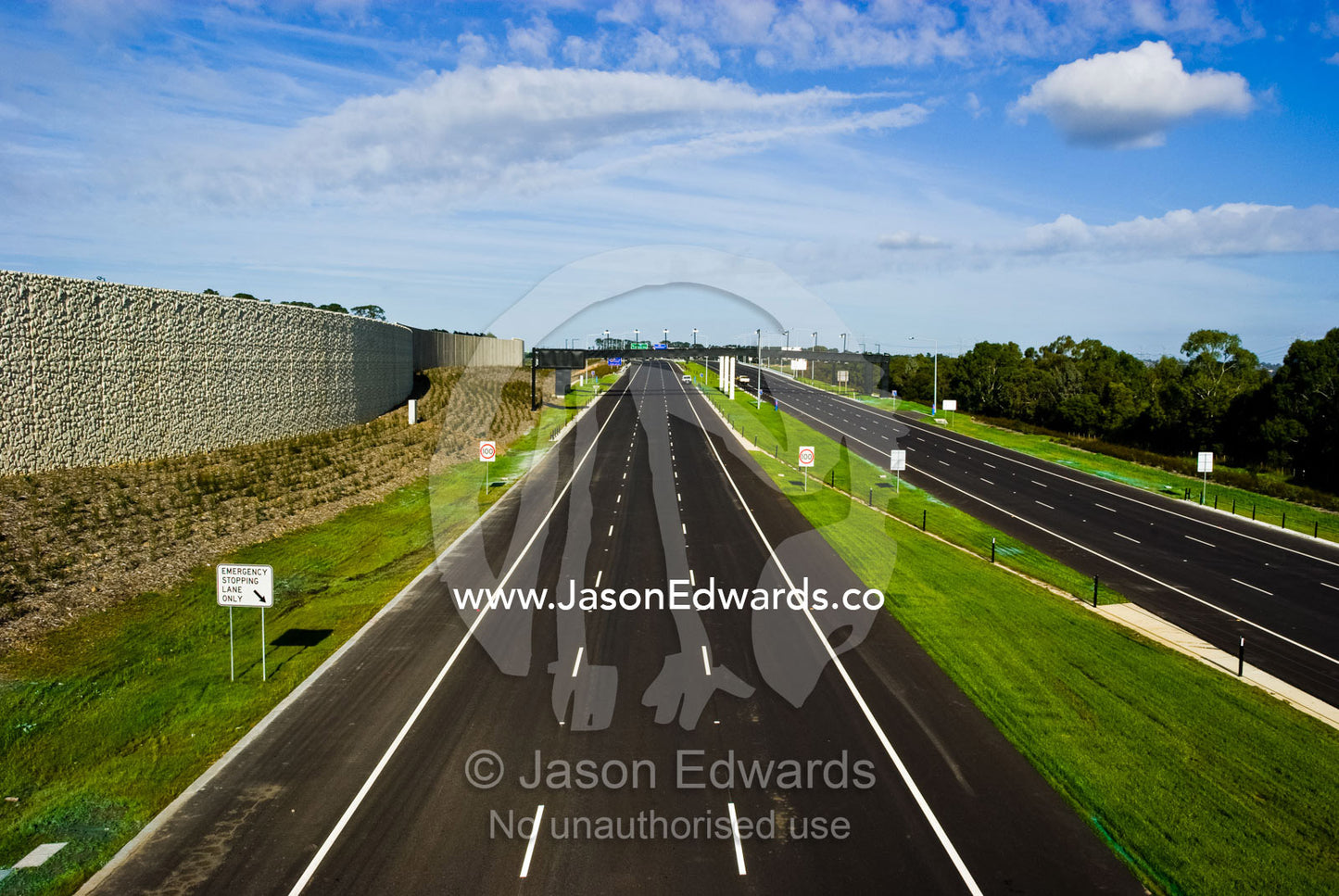 A vast freeway devoid of all traffic is silent on a sunny afternoon. Eastern and Southeastern Suburbs, Melbourne, Victoria, Australia.
