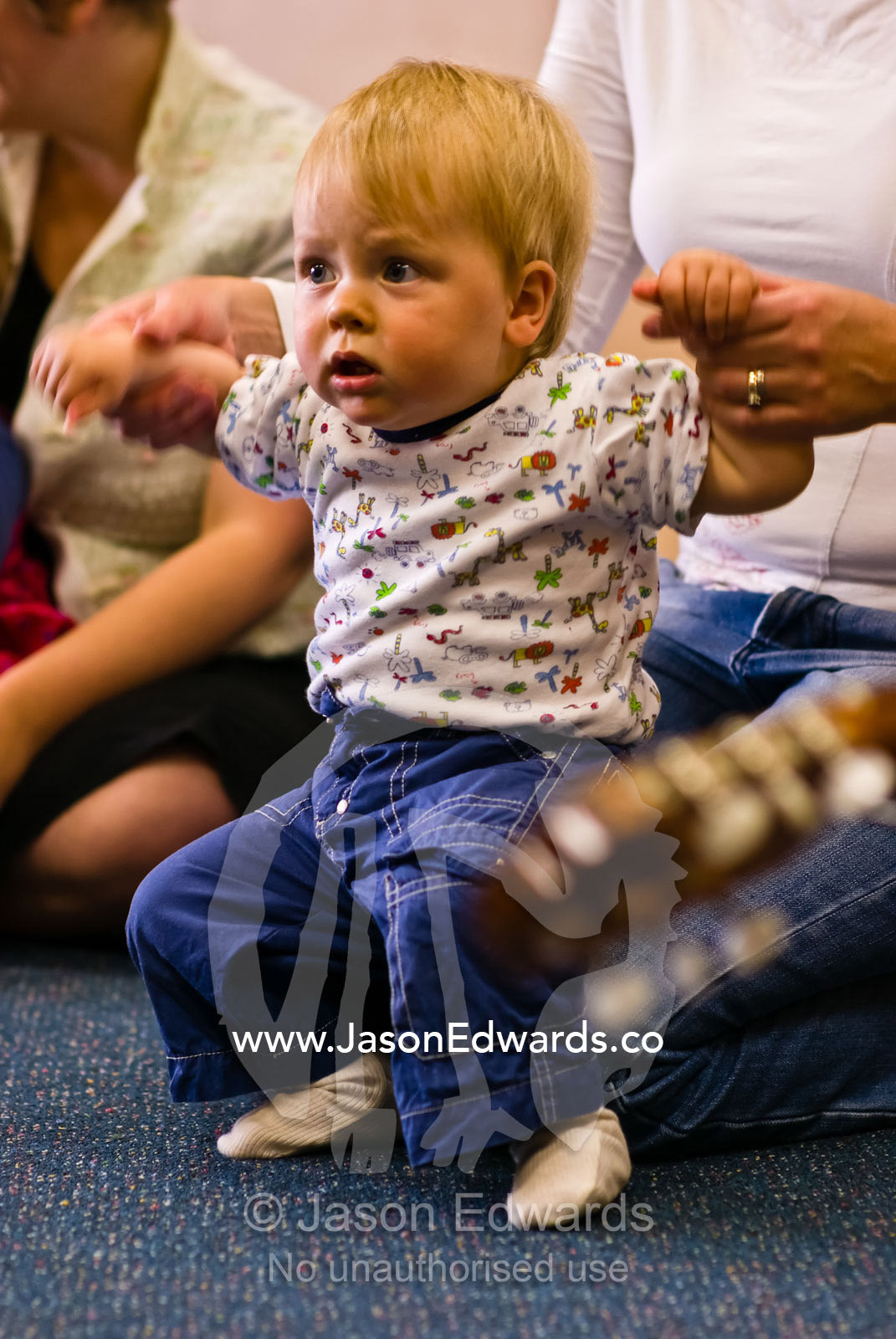 A baby dancing to songs and a guitar in a children's music class. Carlton North, Victoria, Australia.