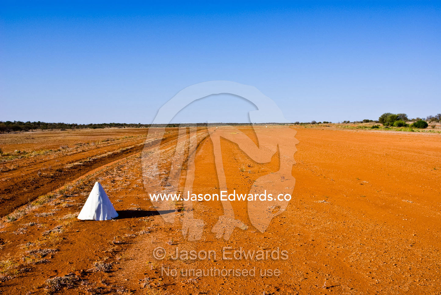 White cones mark the boundary of an outback desert airstrip for pilots Sturt National Park, New South Wales, Australia.