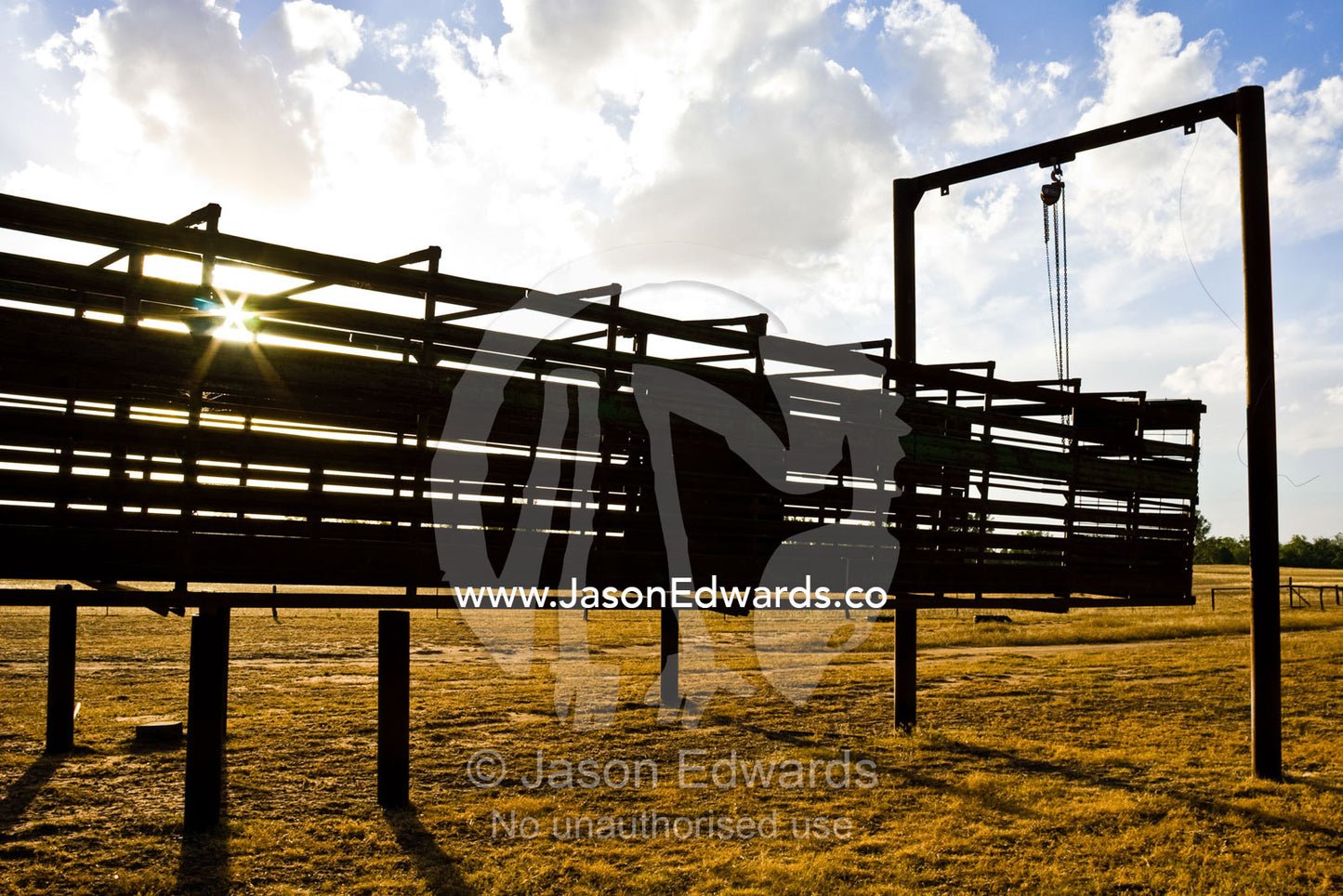 A cage from a cattle truck on a hoist above drought-stricken farmland. Mundiwa Station, Deniliquin, New South Wales, Australia.