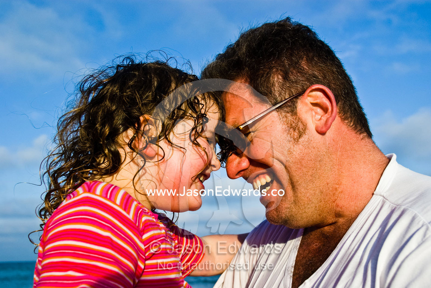 A fun summers afternoon at the beach for a father and daughter. Cosy Corner, Torquay, Victoria, Australia.