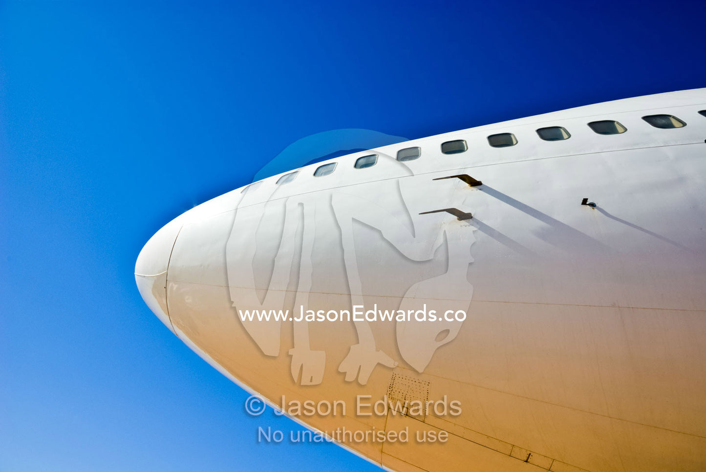 The nose cone of a 747 passenger aircraft soars into a clear blue sky. Longreach, Queensland, Australia
