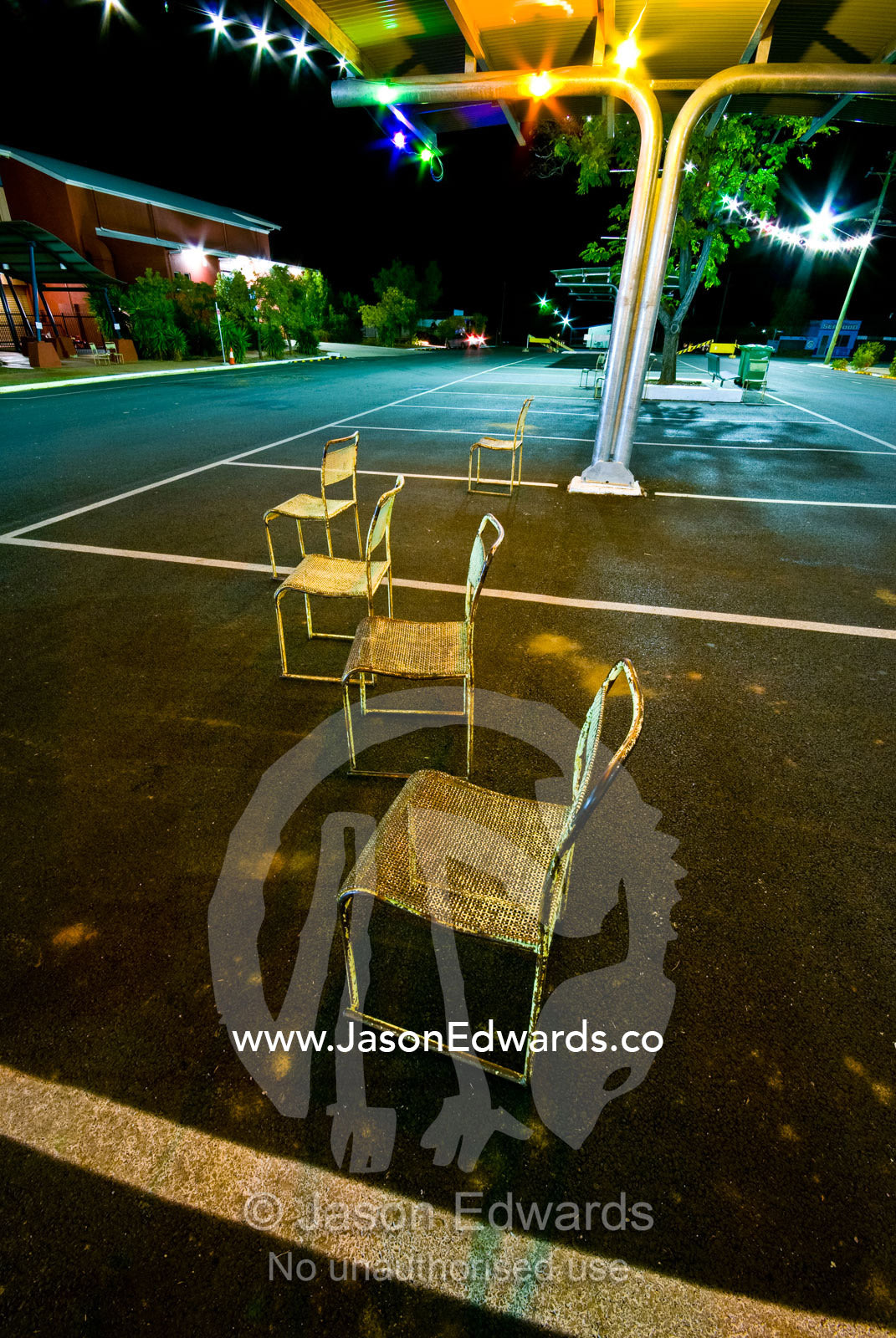 After a festival steel chairs lie scattered along an empty main street Hughenden, Queensland, Australia