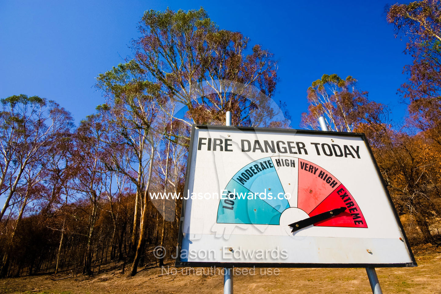 A warning sign in a rural town indicates the current fire threat. Hazeldene, Victoria, Australia