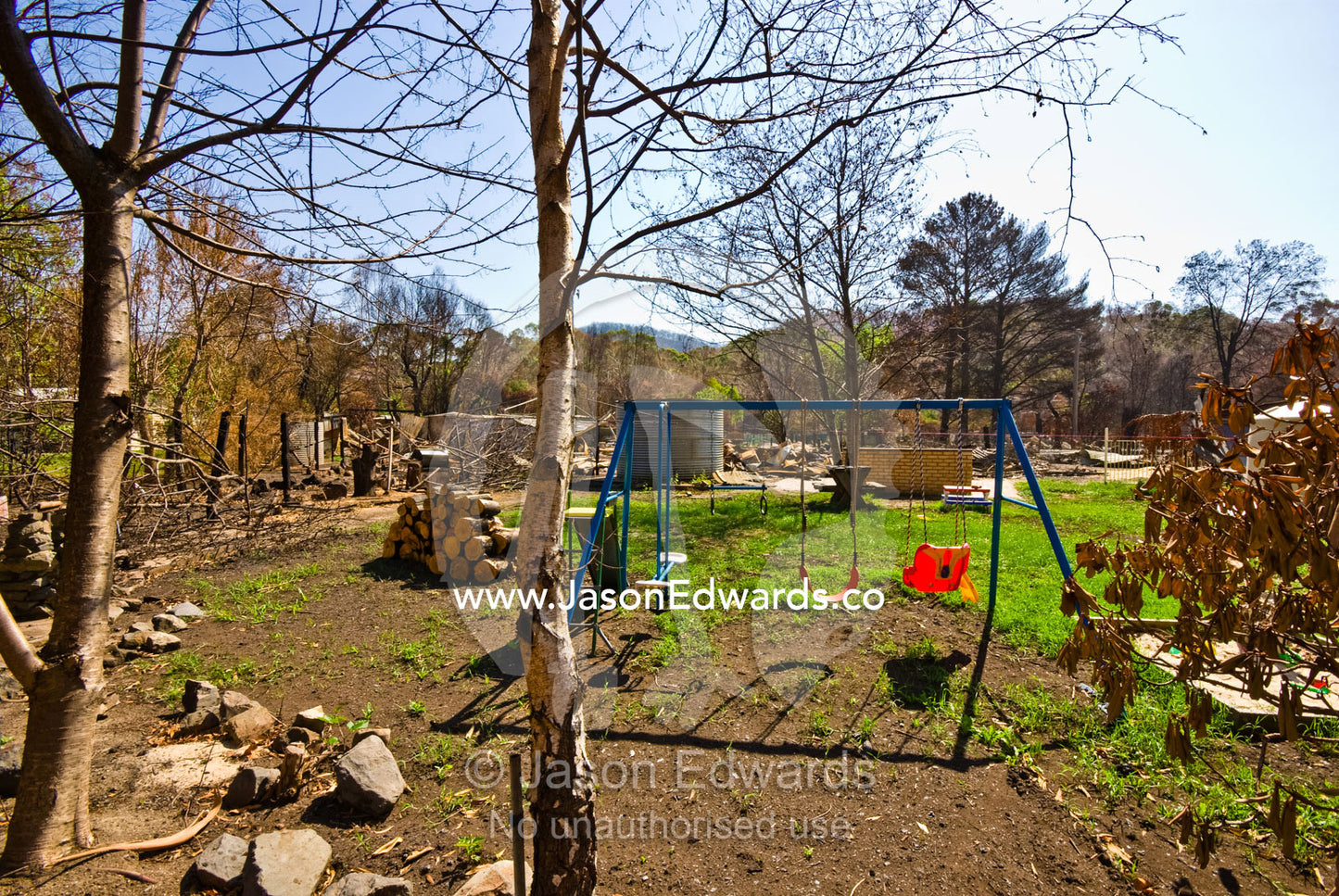 A childs swing survived the fire that destroyed the house and property Hazeldene, Victoria, Australia