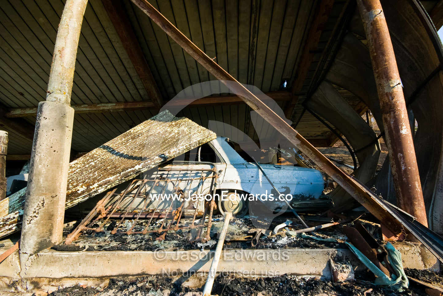 A family home destroyed by fire collapses in on the car garage below. Kinglake, Victoria, Australia