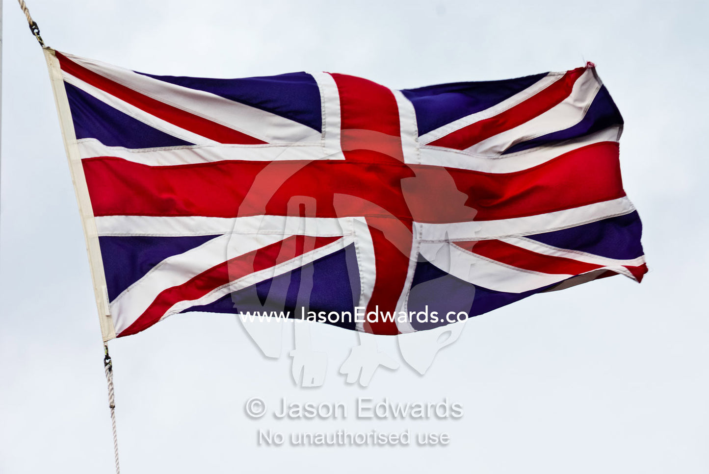 The British Union Jack flag flaps proudly in a stiff wind. Sovereign Hill, Ballarat, Victoria, Australia.