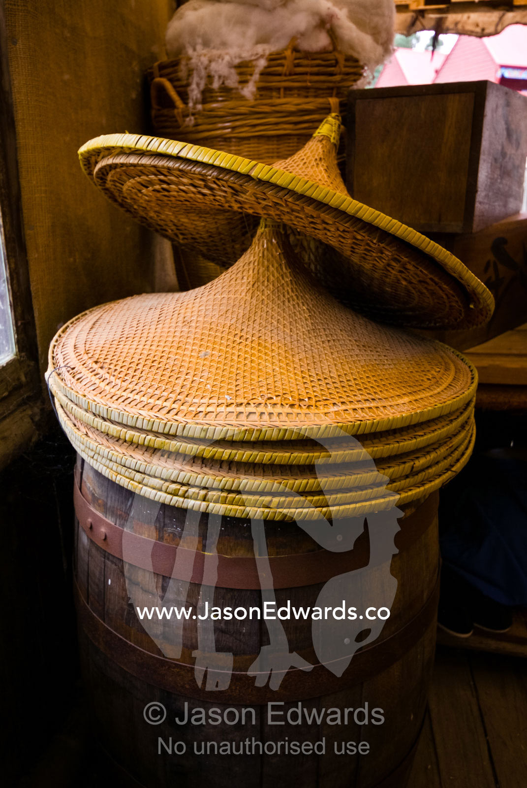 Wide-brimmed woven wicker sun hats on sale for Chinese gold miners. Ballarat, Victoria, Australia.