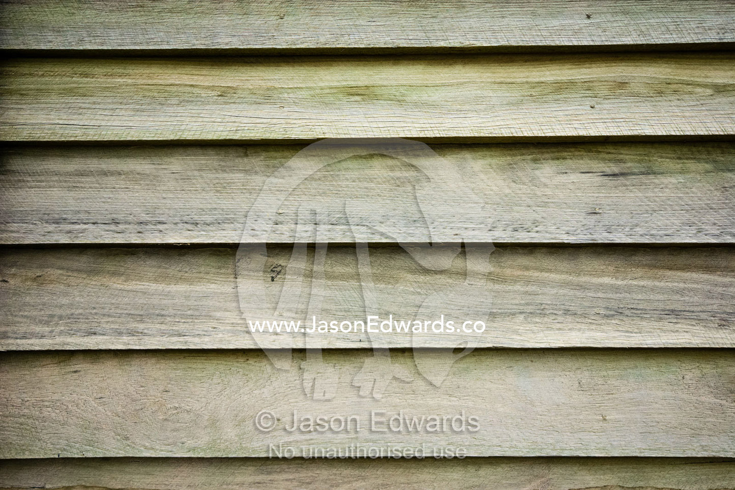 Pine timber slats overlap and seal one another on a workshop wall. Mount Pleasant, Victoria, Australia