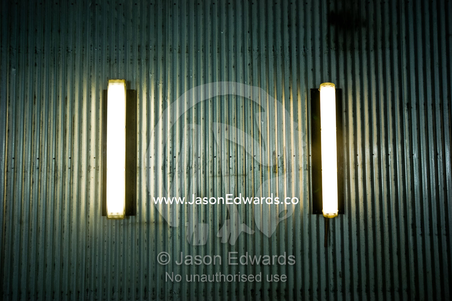 Fluorescent lights in a corrugated stainless steel mechanics workshop. Mount Hotham Alpine Resort, Victoria, Australia