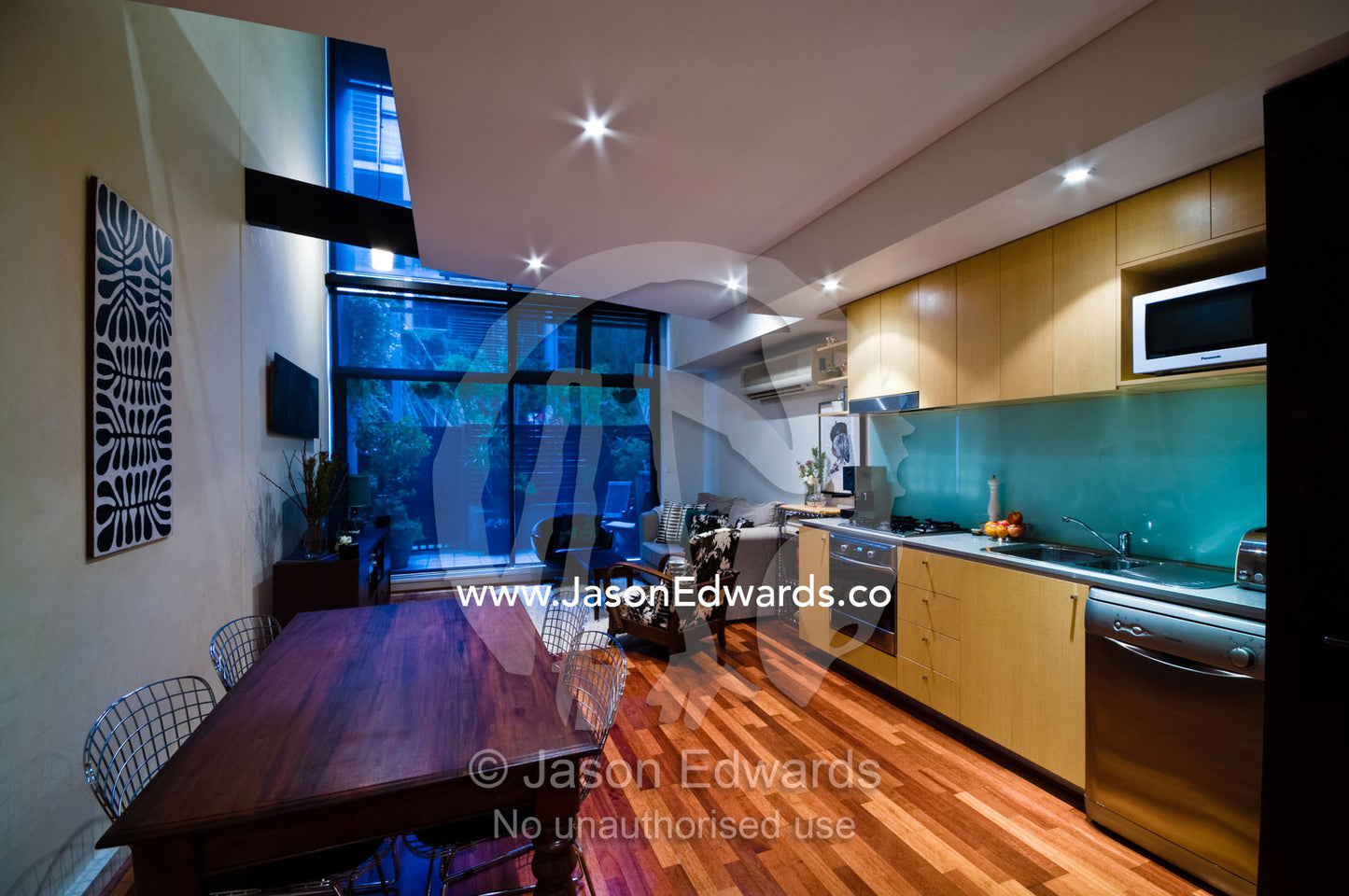 Open plan kitchen, dining and living area in an inner city townhouse. North Melbourne, Victoria, Australia