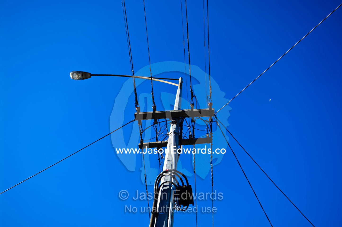 Street lighting and electricity cables attached to a steel pole. Carlton North, Victoria, Australia