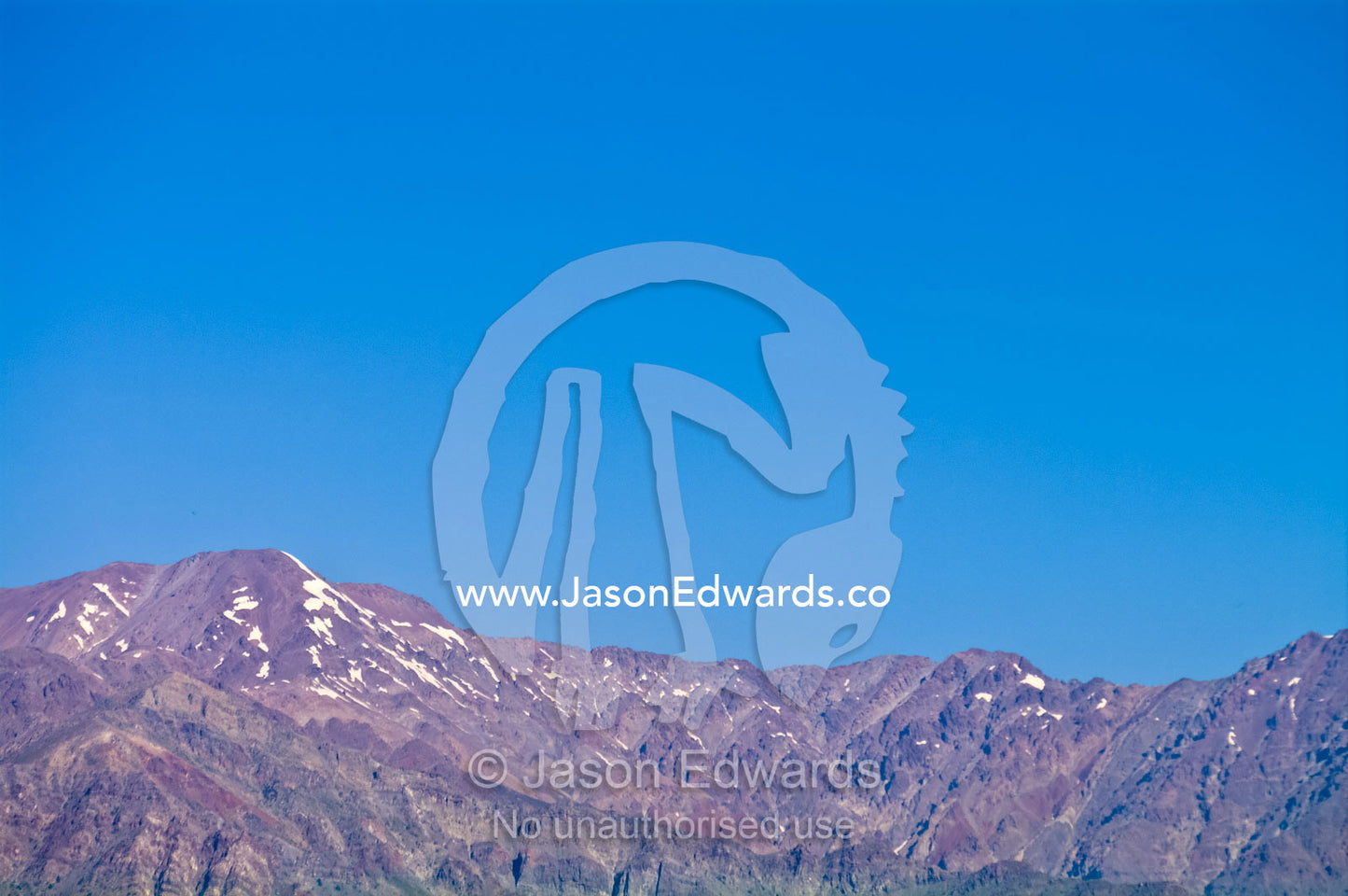 The last of the winter snows cling to rugged bare mountain peaks. Maipo Valley, Andes Mountain Range, Santiago, Chile