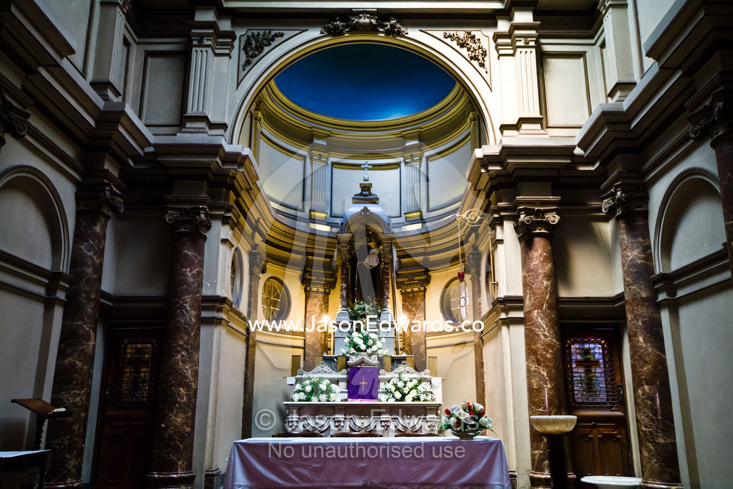 An ornate Catholic temple in a cloister adjacent to the central nave. Iglesia San Francisco, Santiago, Chile