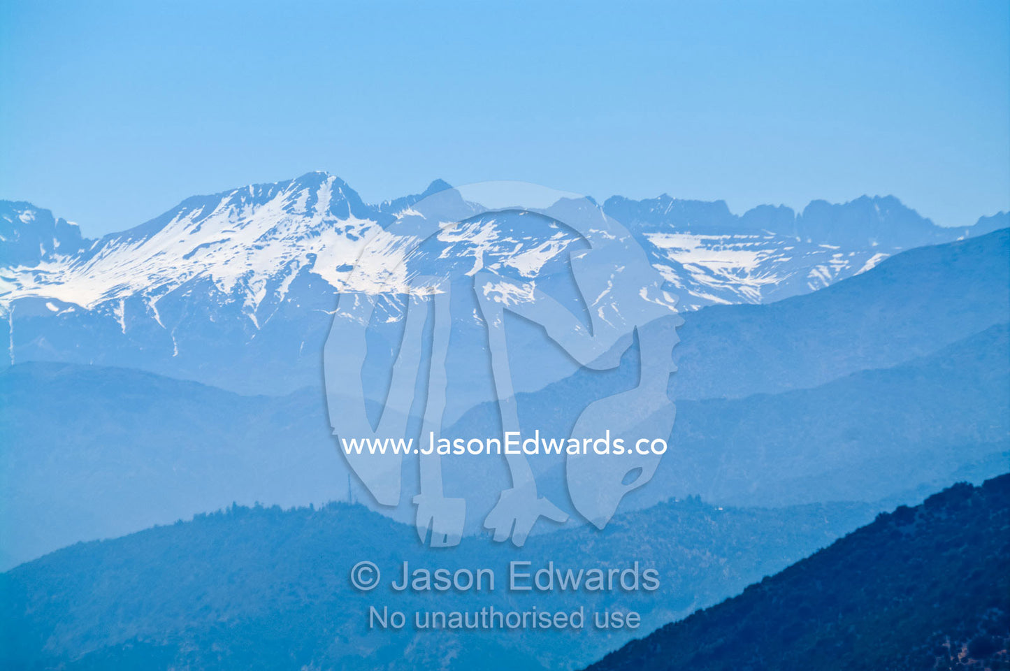 The last of the winter snows cling to rugged bare mountain peaks. Maipo Valley, Andes Mountain Range, Santiago, Chile