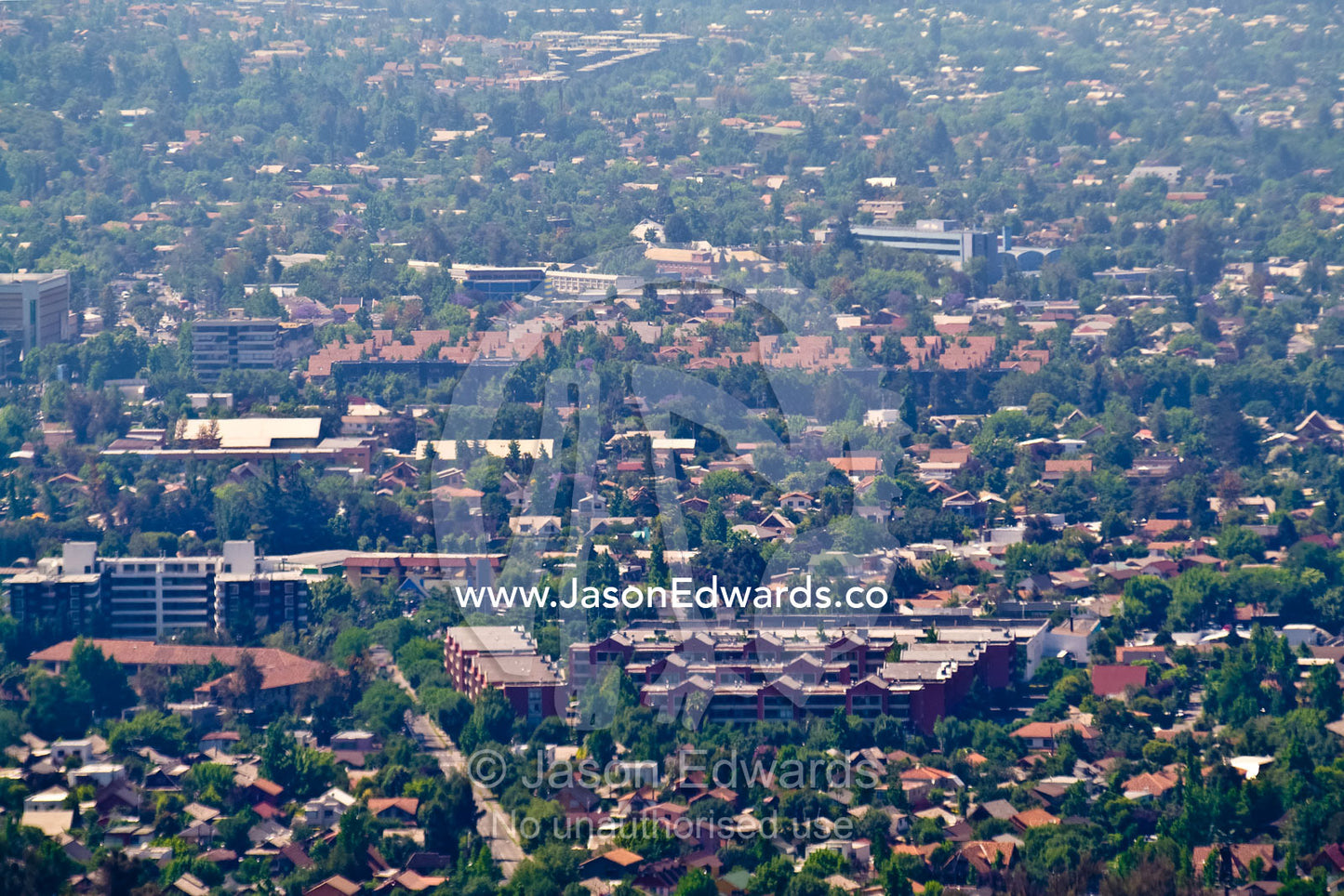 Summer smog and pollution in Santiago's suburbs and business district. Residencial Las Condes from Santa Maria de Manquehue, Santiago, Chile