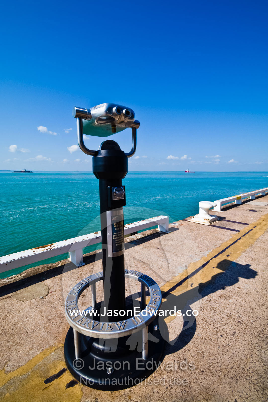 Chrome stainless steel binoculars enable tourists to view the ocean. Darwin Waterfront, Darwin, Northern Territory, Australia